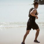 Man Fitness - Man Wearing Black Tank Top and Running on Seashore