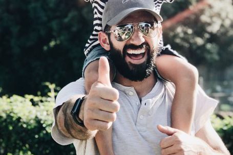 Beard Men - Man Carrying his Son over the Shoulders